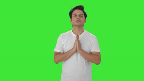 Religious-Indian-man-praying-to-God-Green-screen