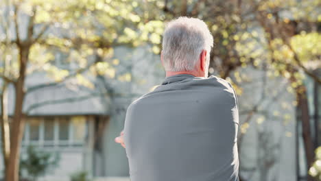 older man stretching outdoors