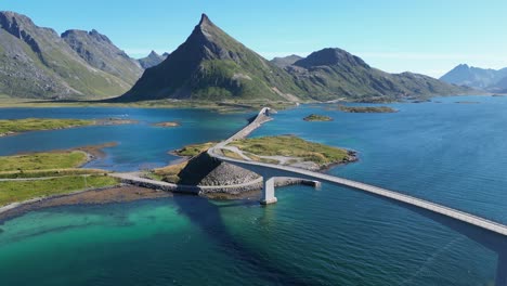 Lofoten-Islands-Fredvang-Bridge-and-Scenic-Route-during-summer-in-Norway---Aerial-Backwards