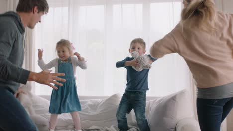 happy family dancing at home having fun dance celebrating together little children celebrate with mother and father enjoying exciting weekend 4k footage