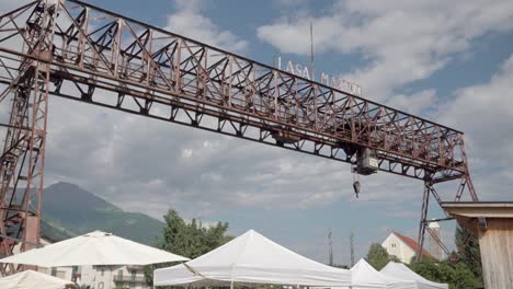 a crane to transport marble blocks at lasa marmo during the open day event marble and apricots in laas lasa, south tyrol, italy.
