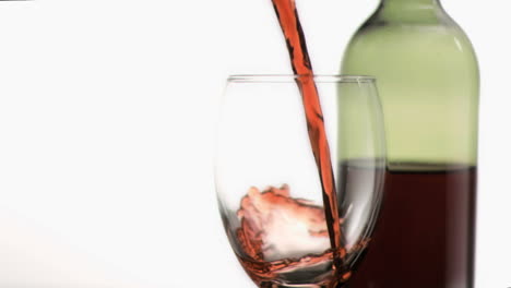 red wine poured in super slow motion into a glass