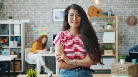 confident asian woman in modern office