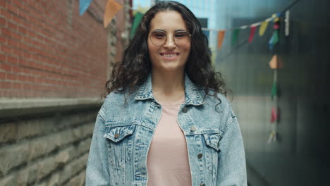 woman smiling in urban alley