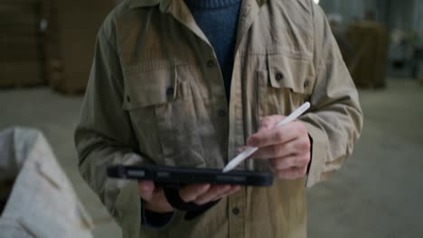 warehouse worker using a tablet