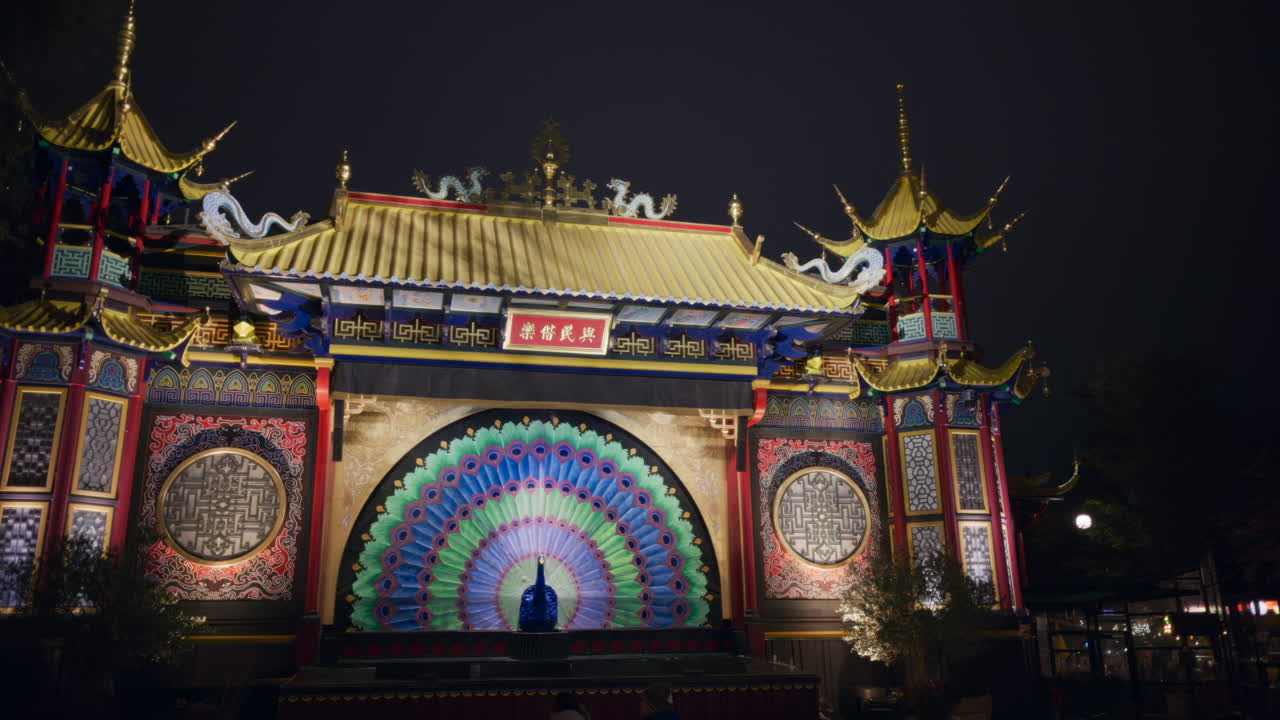 The entrance of the Tivoli Gardens amusement park in Copenhagen, Denmark at night