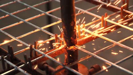 close up of spot welding tip fusing reinforcement wire mesh frame