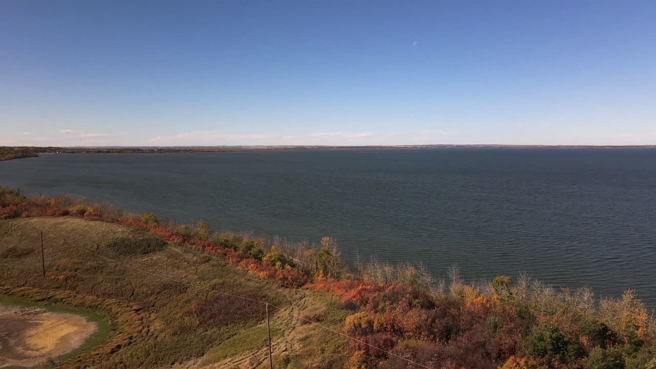 Panning 4k aerial footage from Buffalo lake in rural Alberta during sunny autumn day