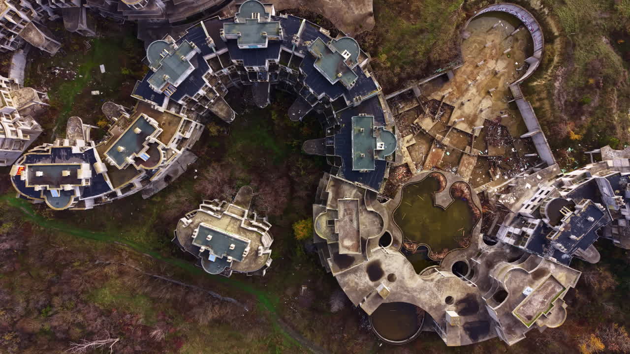 Exploring the haunting beauty of abandoned architecture in a forgotten urban landscape under a cloudy sky