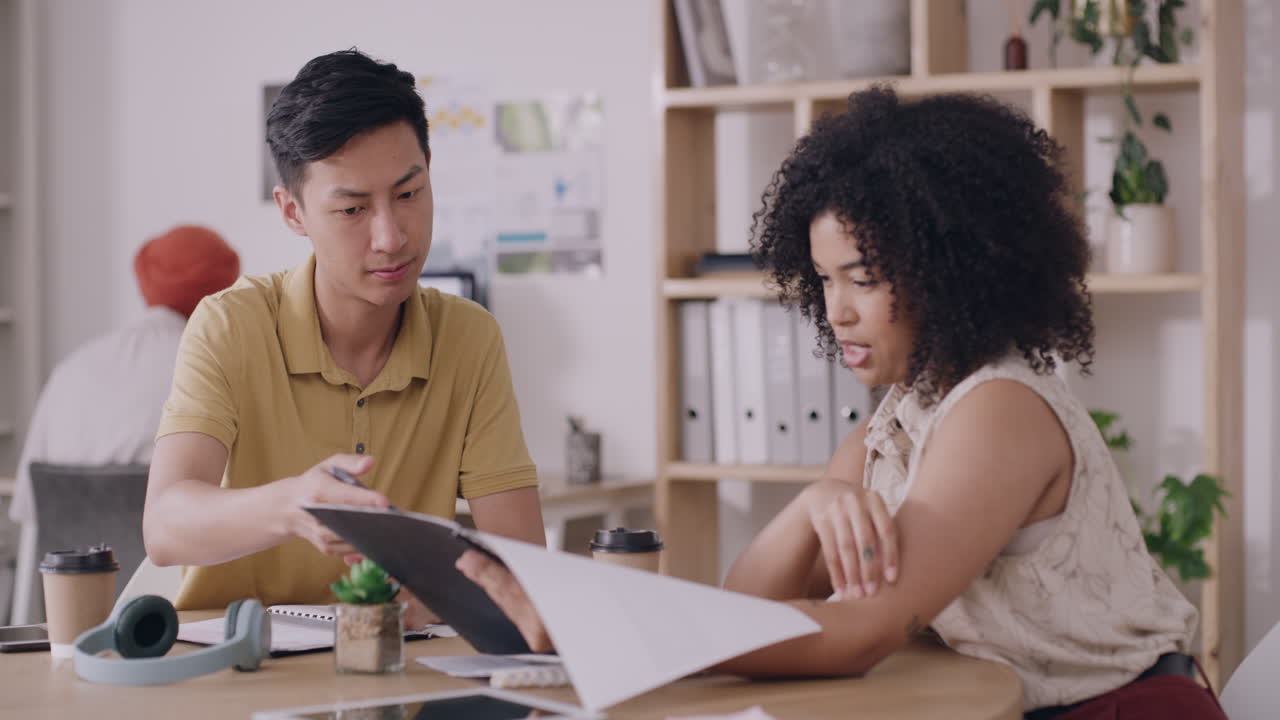 Trendy business people discussing a project during