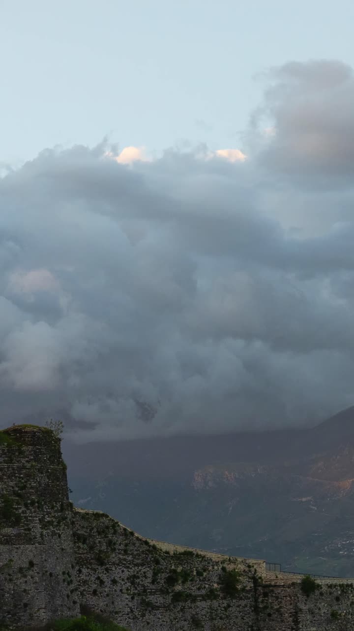 Timelapse of clouds over Albanian mountains at sunset in vertical view