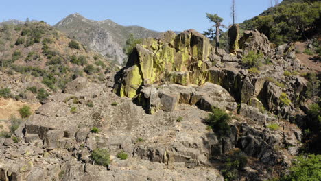 fire retardant chemicals covering california rocky canyon landscape, aerial view