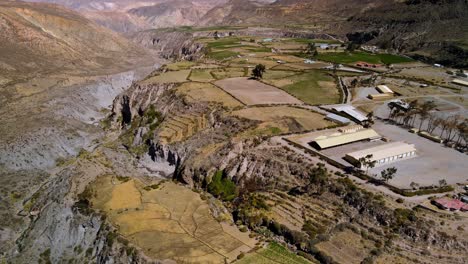 aerial view of a village in the altiplano, sunny evening, putre, chile - reveal , drone shot