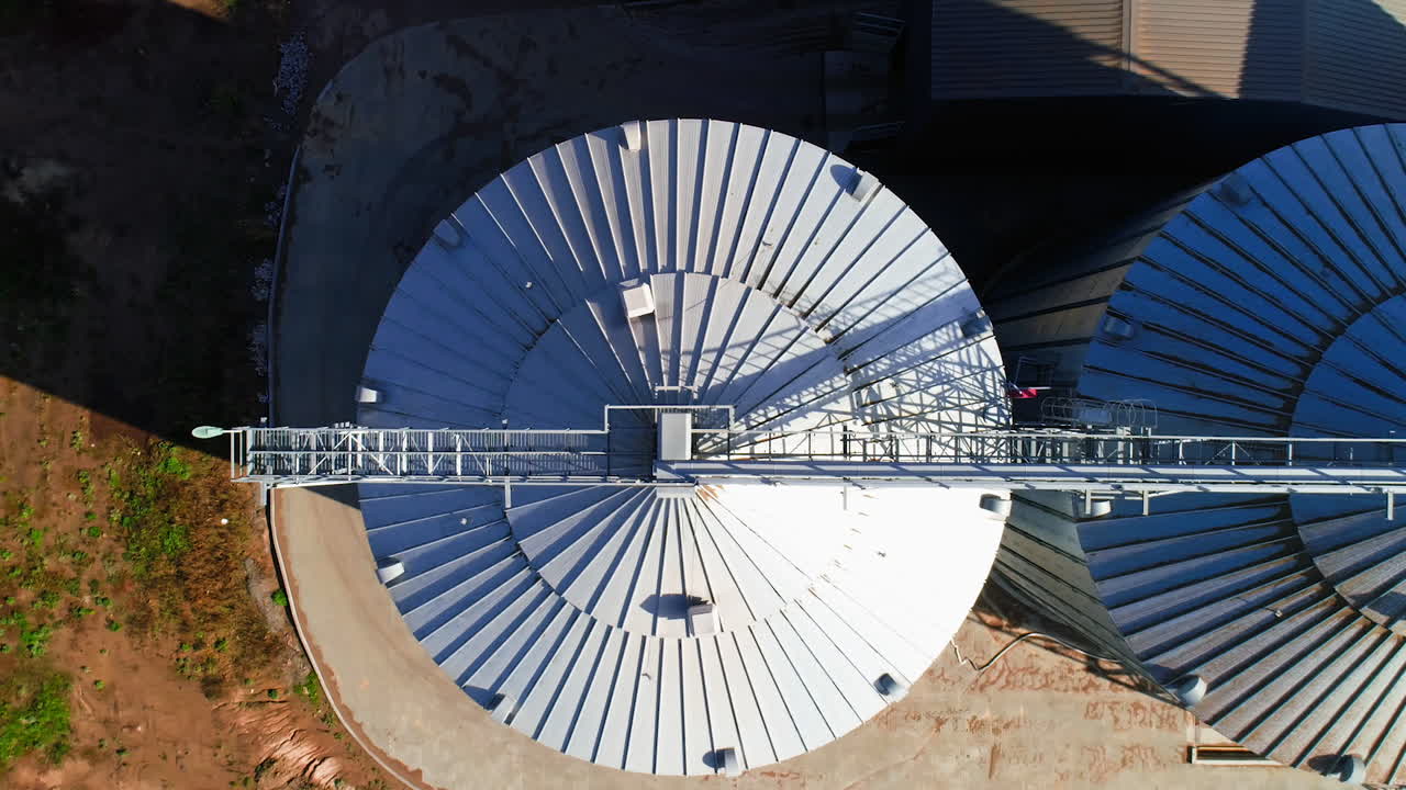 Grain elevator. Metal grain elevator in agricultural zone. Aerial view.