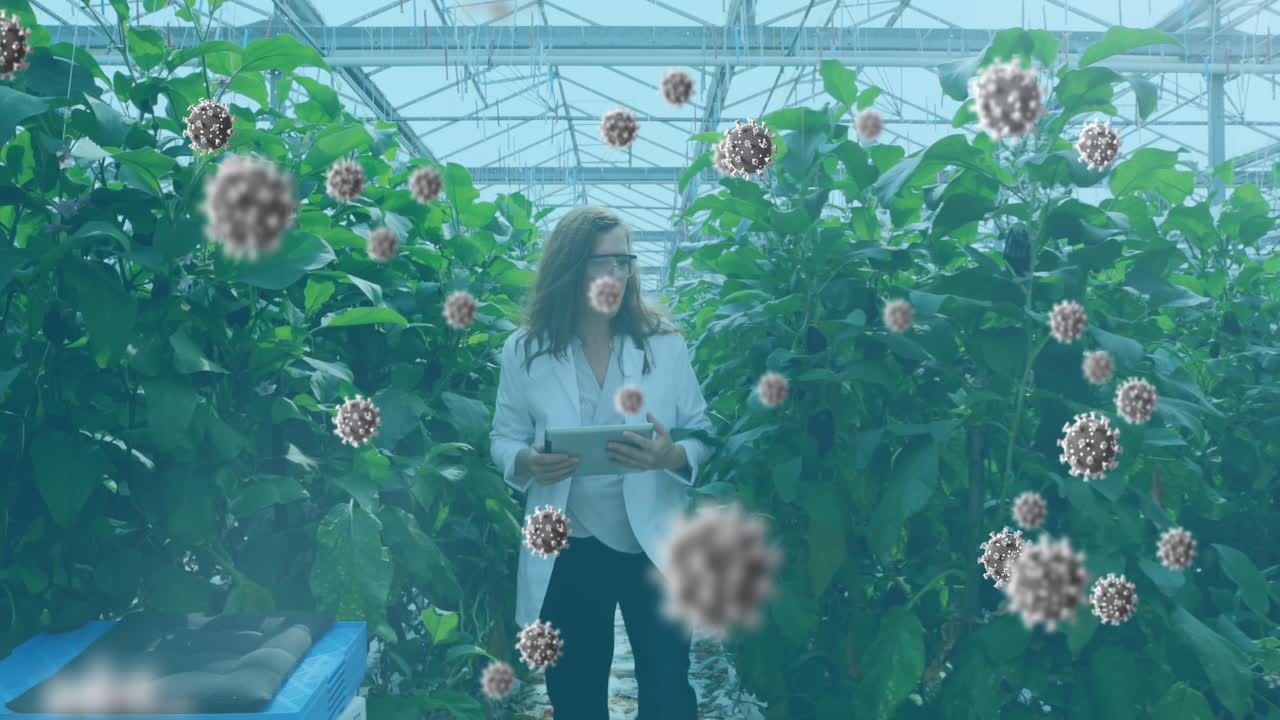 células de covid-19 que se mueven contra una científica que trabaja en un laboratorio de invernadero