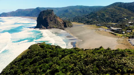 establishing shot of piha beach, famous spot for outdoor activities in new zealand