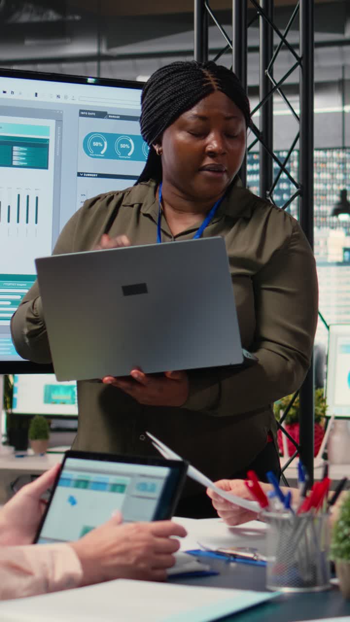 Vertical Video African american woman pitching her ideas with the colleagues team