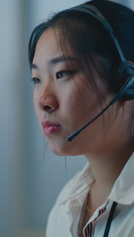 woman wearing headset, profile view