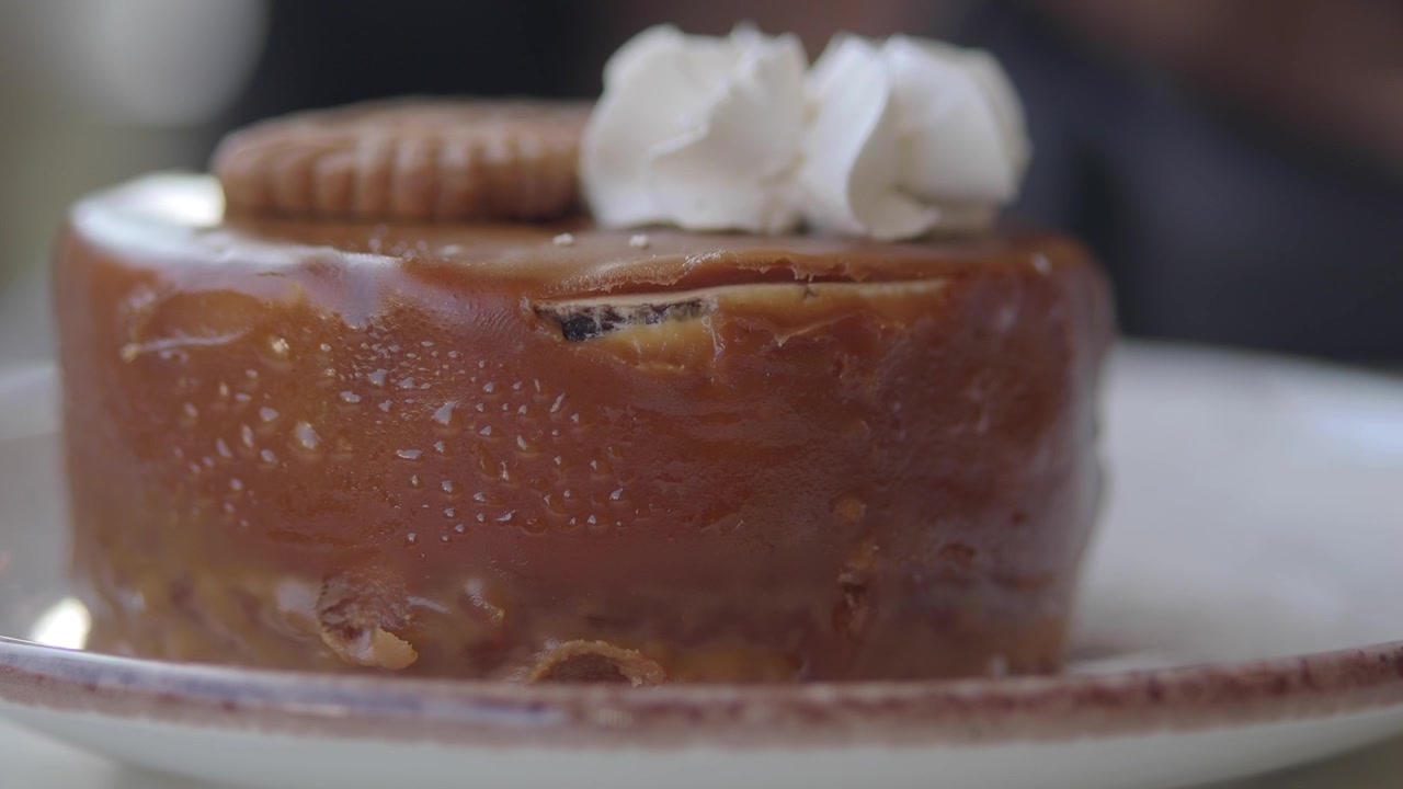 Close-up of a Caramel Glazed Dessert with Whipped Cream