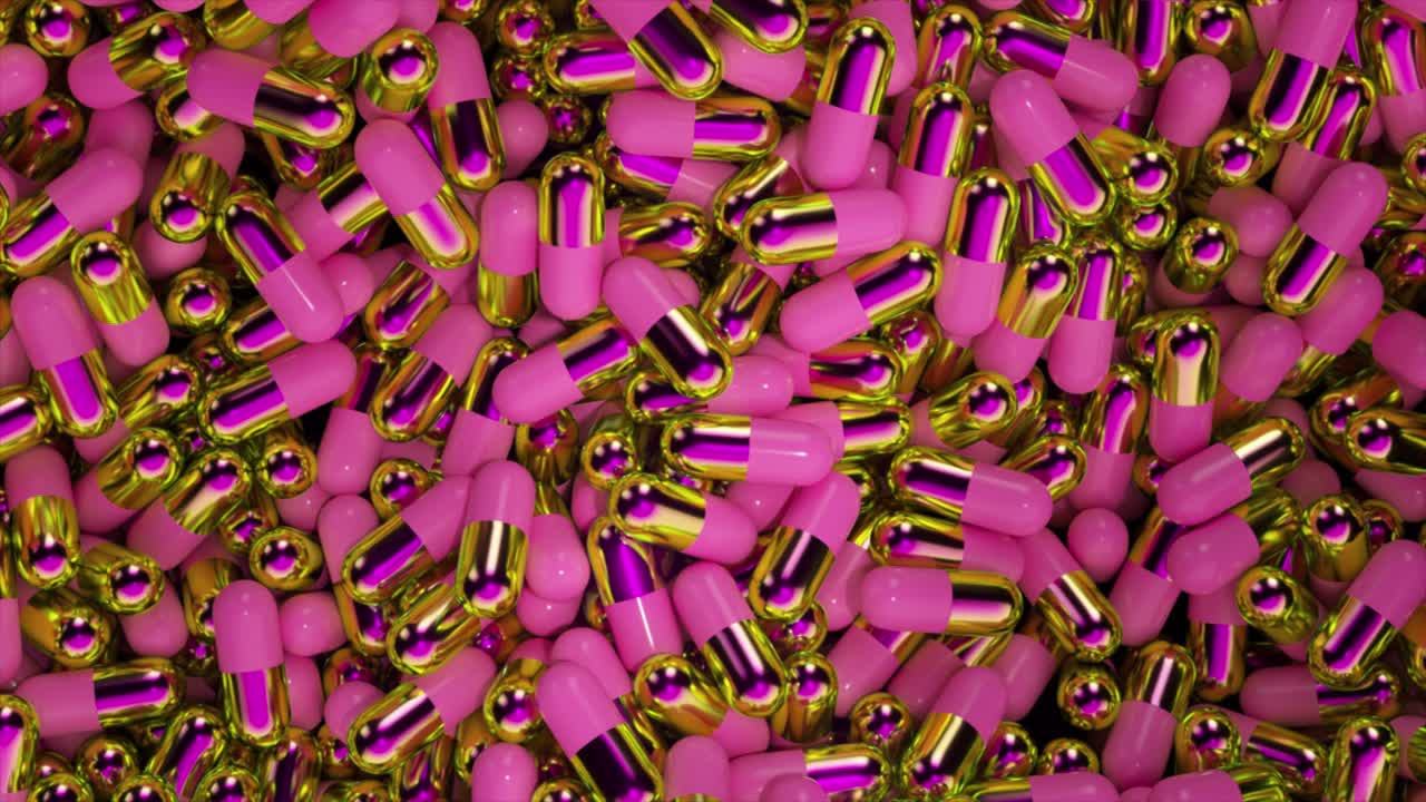 cápsulas rosadas y doradas