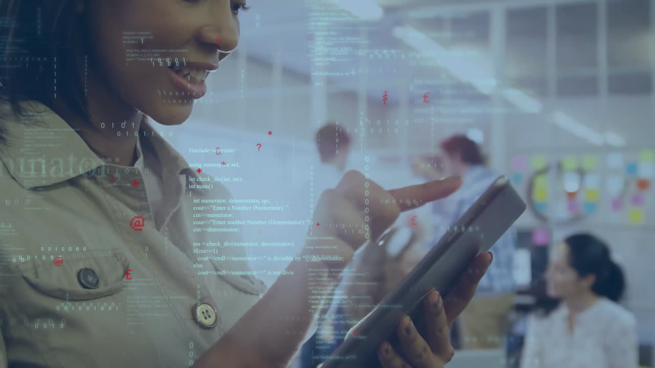 Animation of programming language over smiling biracial businesswoman using tablet in office
