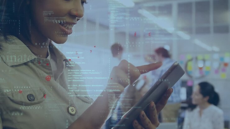 Animation of programming language over smiling biracial businesswoman using tablet in office