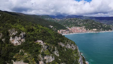 rocky mountainscape along the coastal town of noli in liguria, italy. aerial drone shot