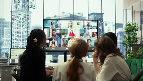 company employees attending a meeting via videocall with investors