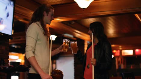 couple having beer in night club 4k