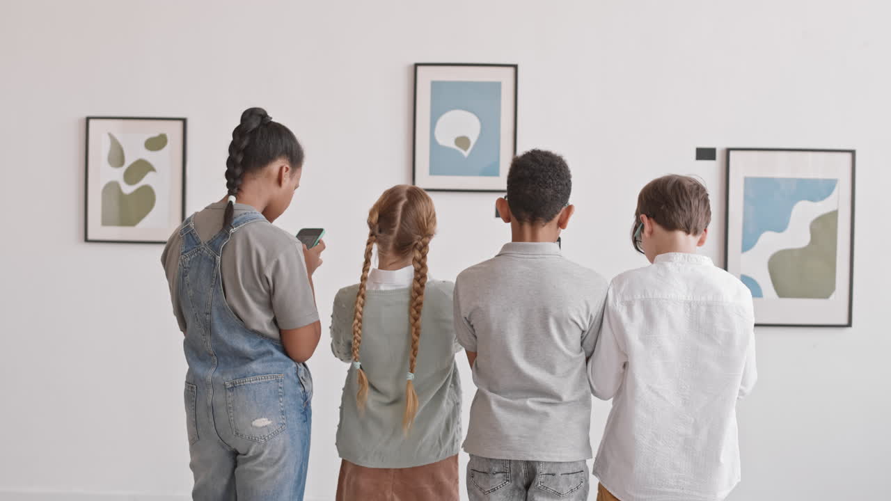 Classmates Taking Pictures of Paintings