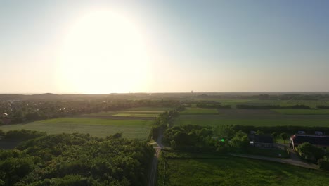aerial view of sunset over green agricultural fields of zeeland, netherlands