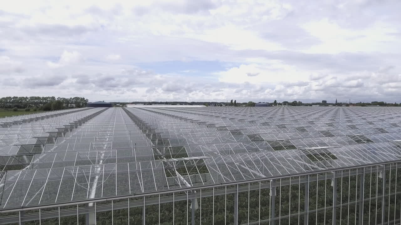 4K Aerial Close-Up Forward Shot over an Glass Greenhouse in the Netherlands