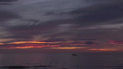 timelapse cloudscape dawn skies over calm sea at sunrise