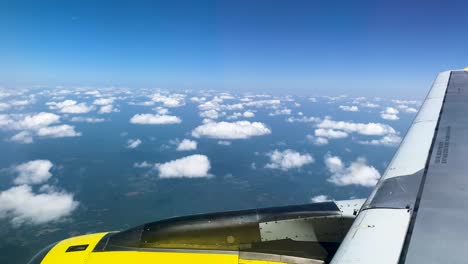 Aerial-shots-from-a-window-of-a-Boeing-747-plane,-cloudscape-during-the-trip