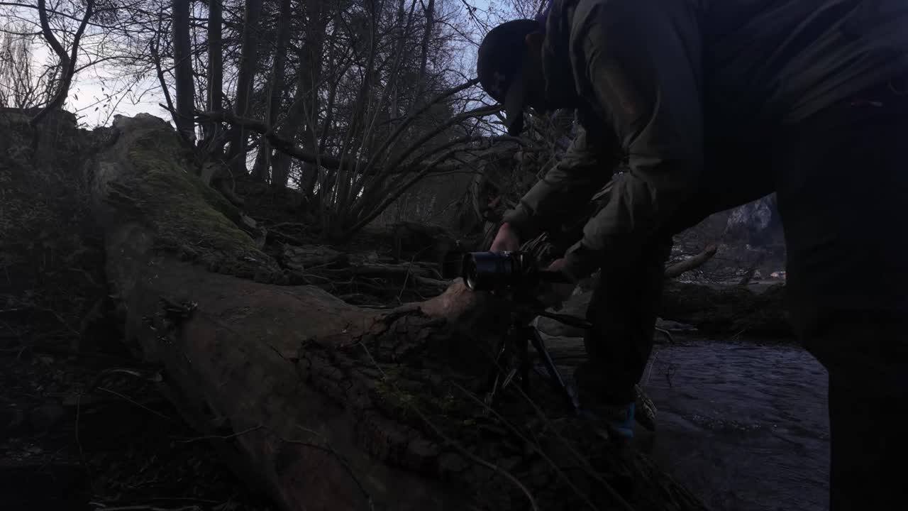 Outdoor nature photographer videographer professional camera set-up tripod