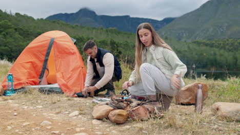 Campfire,-couple-and-help-with-tent-in-nature