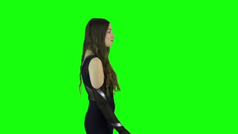 portrait side view of a beautiful female model acting in front of a green screen