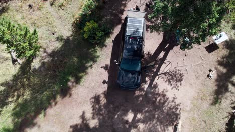 aerial over a truck at a campsite with