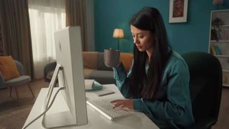 woman working at home on computer