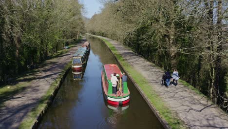 A-Narrow-Boat-heading-down-stream-to-Cross-the-Pontcysyllte-Aqueduct,-famously-designed-by-Thomas-Telford,-located-in-the-beautiful-Welsh-countryside,-the-Llangollen-Canal-route