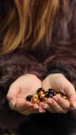 woman holding skincare capsules in her hands