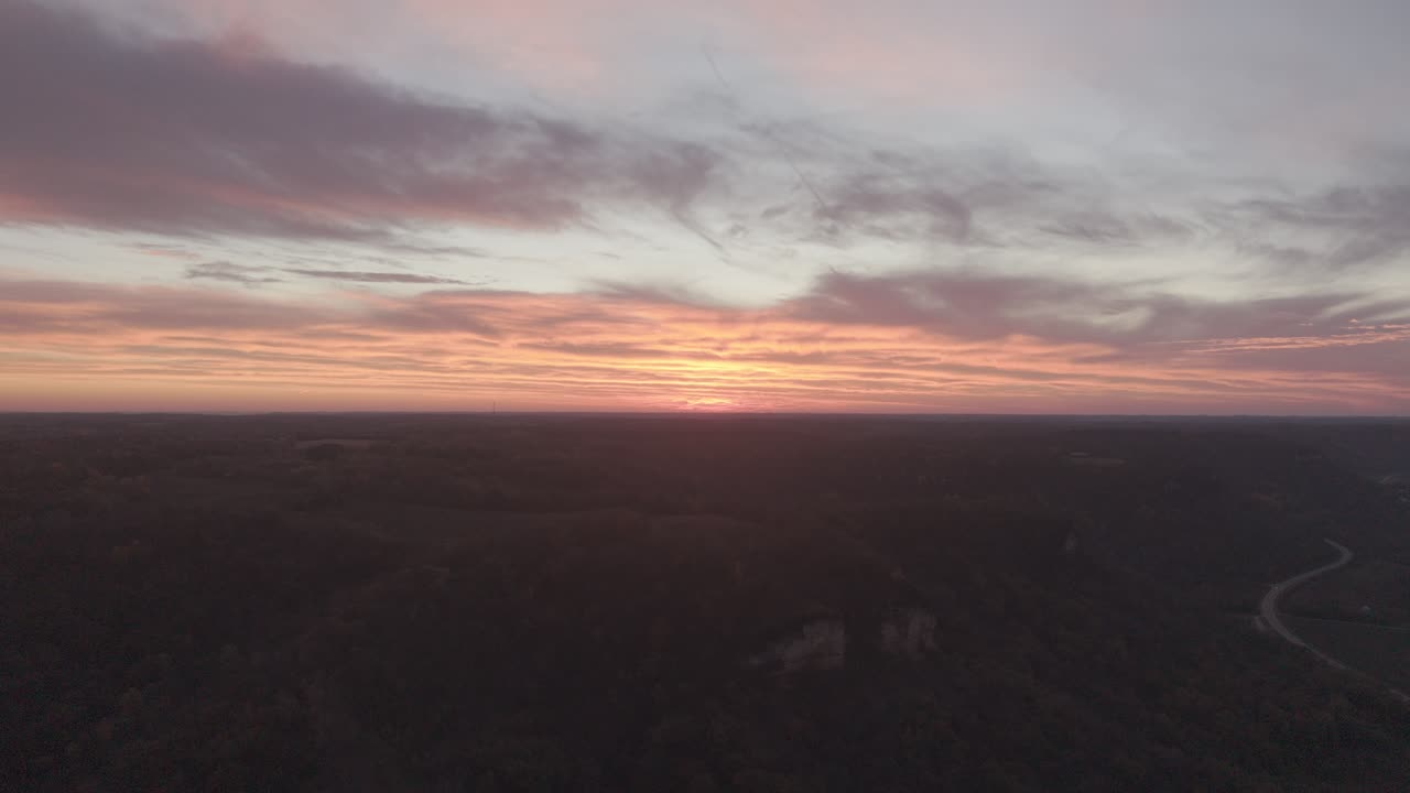 Aerial View of a Dramatic Sunset Over a River Landscape