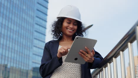 woman engineer using tablet in the city