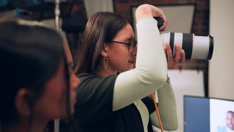 a female photographer taking pictures in a studio