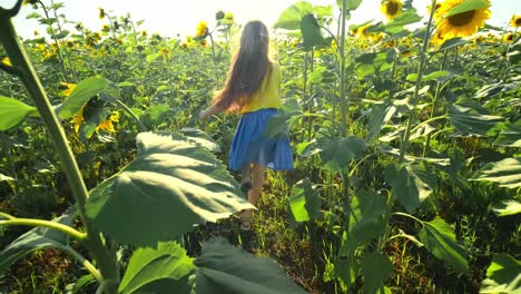 Child Running Through a Sunflower Field