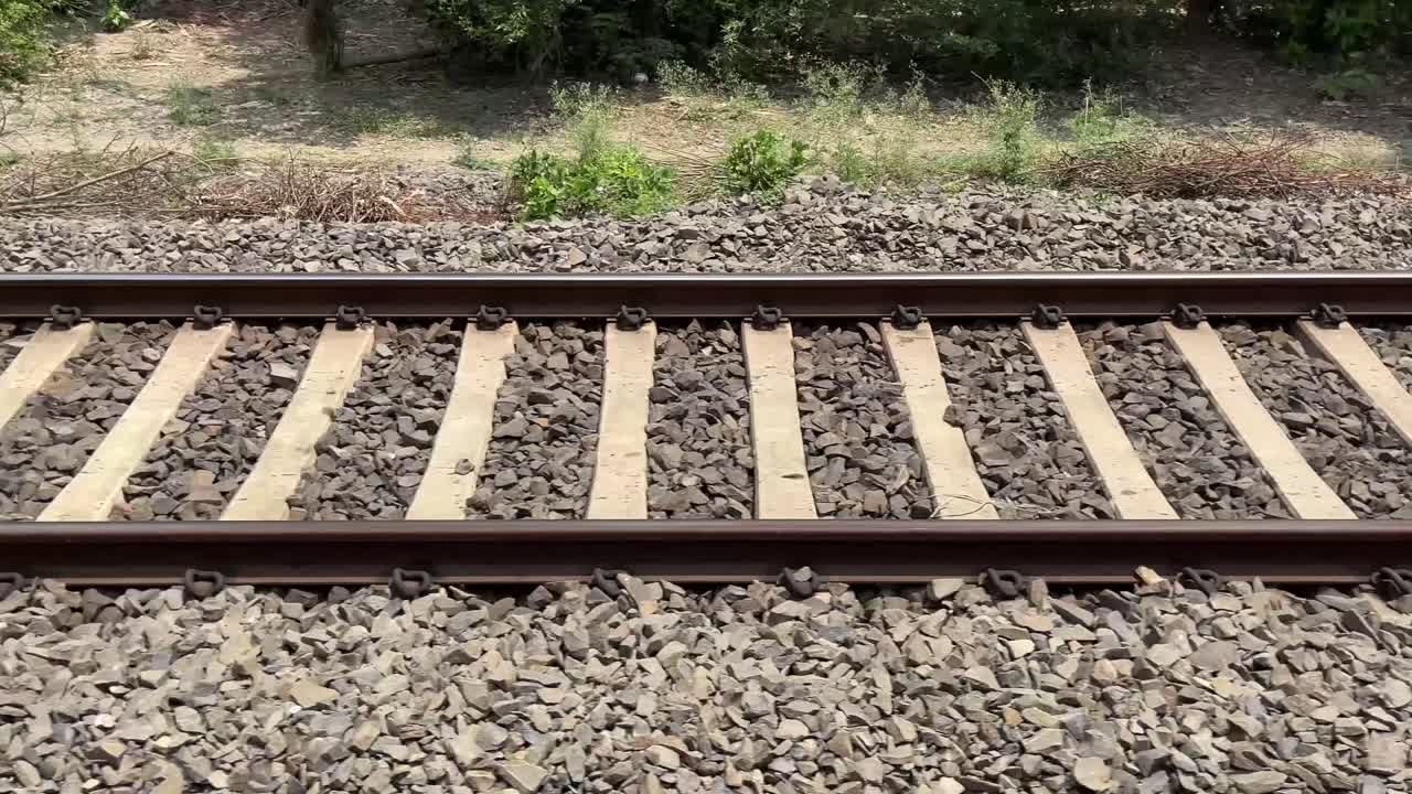View of the train line from inside the train to outside