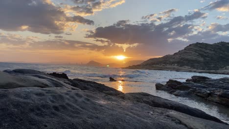 static peaceful 4k clip of the sun setting above mediterranean sea in the east of spain