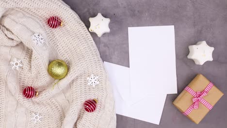 winter christmas accessories appear with paper in envelope for text. stop motion