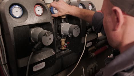 hvac technician installs heating, ventilation and air conditioning systems