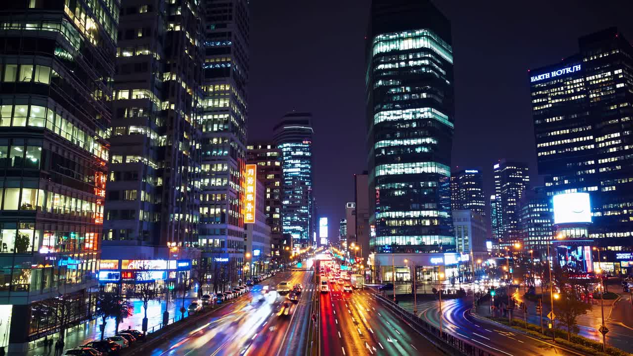 Dynamic cityscape video with a high-angle view of bustling traffic and illuminated skyscrapers
